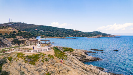 Sarti, Greece. Summer travel paradise. Drone perspective of a rocky Greek seashore. Nearly cloudless sky. Beautiful weather. High quality photo