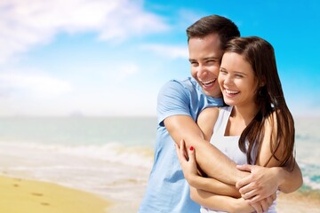 Happy satisfied smiling young couple family man woman hug rest together at sunrise over sea beach ocean outdoor seaside in summer day