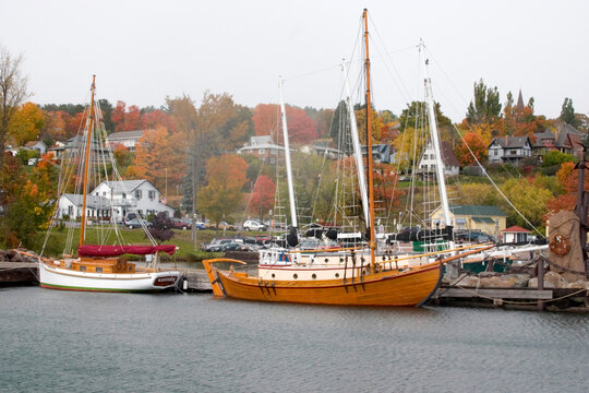 Sailboats Docked At Marina Slips.