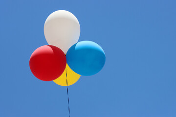 colorful balloons on blue sky