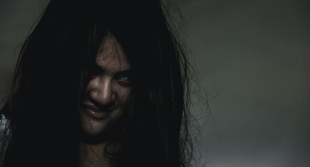 Scary ghost woman. Portrait of Asian ghost or zombie horror creepy scary have hair covering the...