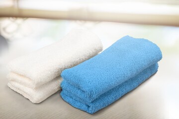 Fototapeta na wymiar Soft colored towel on light background