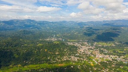 Aerial view of mountain valley with a town and agricultural lands. Gampola Town, Sri Lanka.