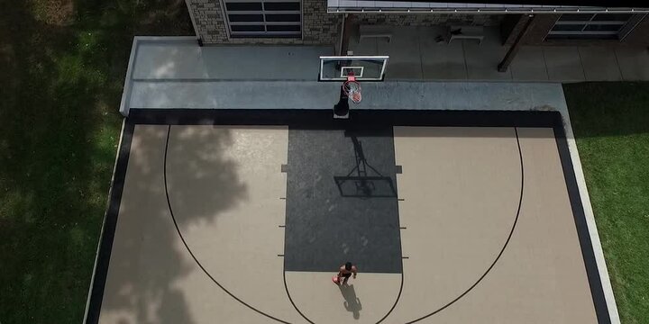Drone Shot of a teenager shooting a free throw