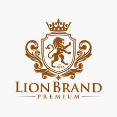 Luxury Lion crest heraldry logo. Elegant gold heraldic shield icon. Premium brand identity emblem. Royal coat of arms company label symbol. Modern vector illustration. © pervector