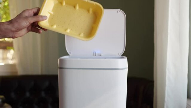 Polystyrene container waste. Expanded polystyrene packaging for food. Household waste. Contactless Smart Touch Trash Can