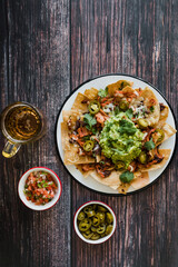 Mexican nachos chips with american cheese and avocado, traditional food in Mexico Latin America	
