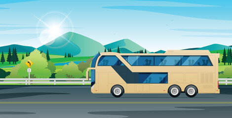 A tourist bus is running on a highway with mountains in the background.