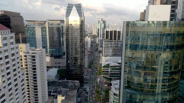 Beautiful aerial cinematic view of Panama City, and its skyscrapers - Panama City night lights - Sunset