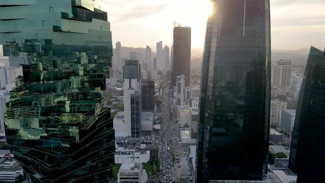 Beautiful aerial cinematic view of Panama City, and its skyscrapers - Panama City night lights - Sunset
