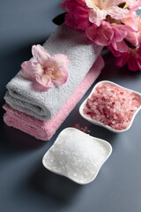Spa composition with pink and white sea salt.