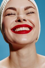 An excited happy girl in a swimming cap with red lips smiles at the camera. Close portrait