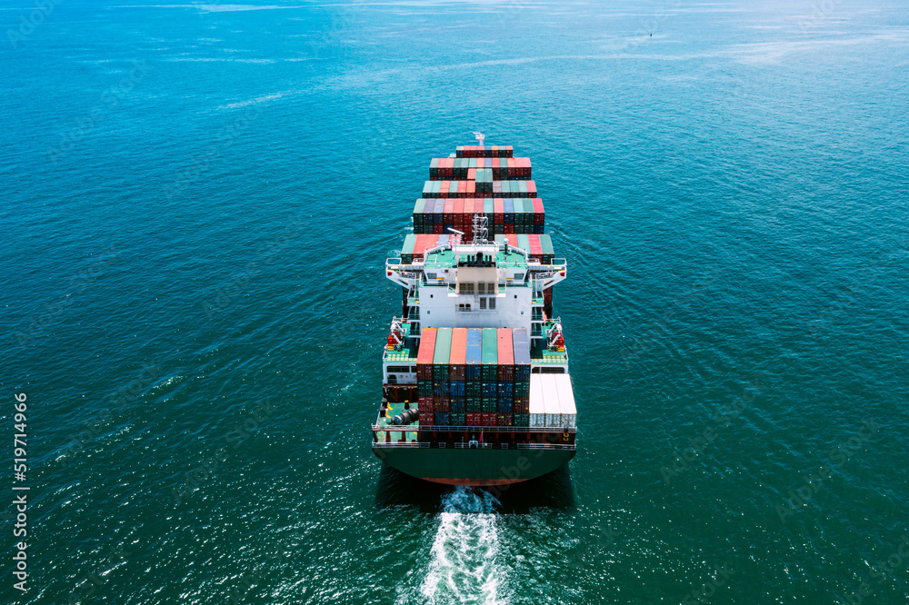 Wall mural Aerial view of  worldwide Cargo container shipping. Global Freight Forwarding, Business logistic transportation in the ocean ship carriers in the global container, Cargo ship,