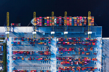 Aerial top view of container ship loading and unloading in cargo shipping port, Container cargo ship import - export terminal for the international order concept.