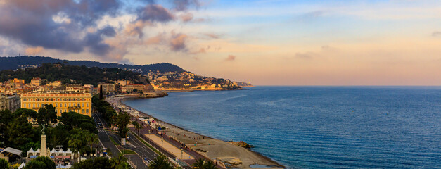 Fototapeta na wymiar Nice coastline at Promenade des Anglais on the Mediterranean Sea South of France