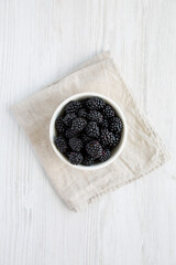 Raw Blackberries in a Bowl, top view. Flat lay, overhead, from above.