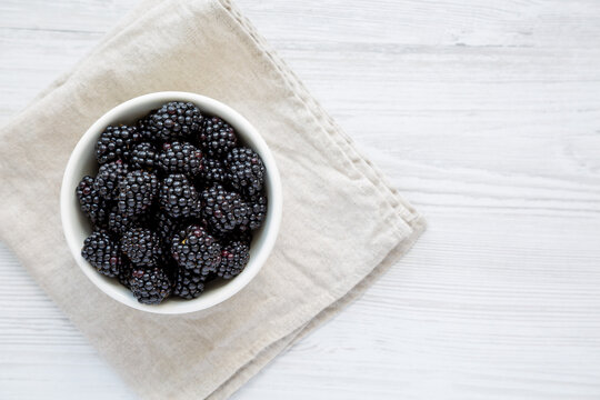 Raw Blackberries In A Bowl, Top View. Flat Lay, Overhead, From Above. Copy Space.