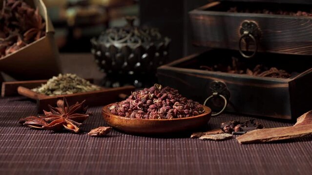 Chinese traditional seasoning five spice powder and raw materials on retro background