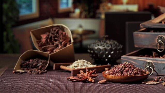 Chinese traditional seasoning five spice powder and raw materials on retro background
