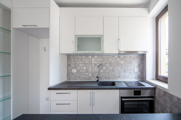 New modern and empty white kitchen. New home. Interior photography.