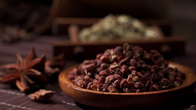 Chinese traditional seasoning five spice powder and raw materials on retro background