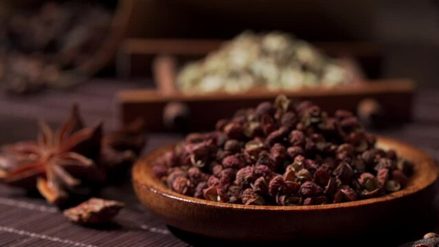 Chinese traditional seasoning five spice powder and raw materials on retro background