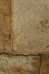 Destroyed cracked wall background, brown light texture, paint streaks.