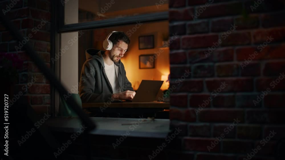 Poster Professional Software Engineer Working From Home Office. Tired IT Specialist Feeling Sleepy and Finising Important Project. Software and Application Development. View From Outdoors into Window.