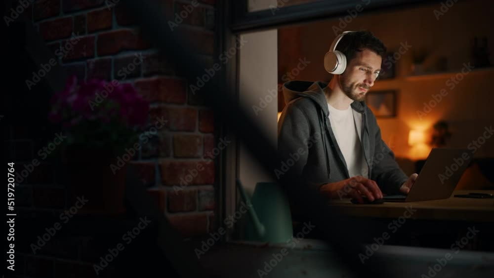 Poster Professional Software Engineer Working From Home Office. Tired IT Specialist Feeling Sleepy and Finising Important Project. Software and Application Development. View From Outdoors into Window.