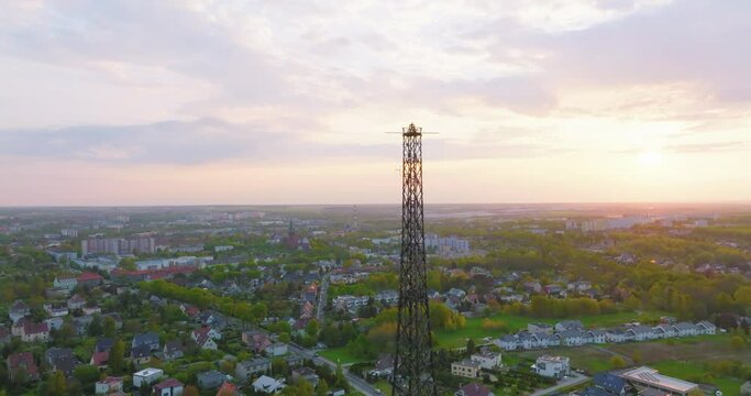 Aerial view of the wooden broadcasting tower in Gliwice with the city of Gliwice in the background. The concept of the largest wooden tower in the world. Wooden construction from a drone.