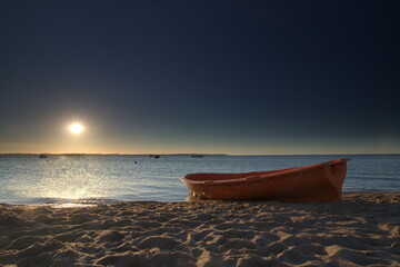 boat on the beach and sun
