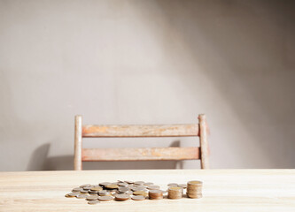 Coins stacked on an abstract vintage table. Savings ideas for economic investment, stable growth, and saving for retirement.