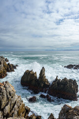 Obraz premium The beautiful coastline at De Kelders with a view across Walker Bay towards Hermanus, Overberg, Western Cape, South Africa.