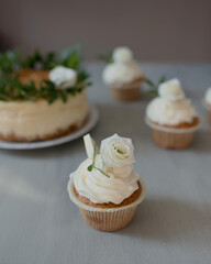 Delicious pastries decorated with flowers and greenery