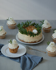 Delicious pastries decorated with flowers and greenery