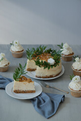 Delicious pastries decorated with flowers and greenery