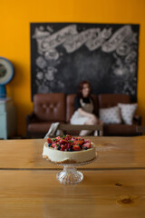 Pastries decorated with berries in the kitchen in a modern interior