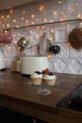 Pastries decorated with berries in the kitchen in a modern interior