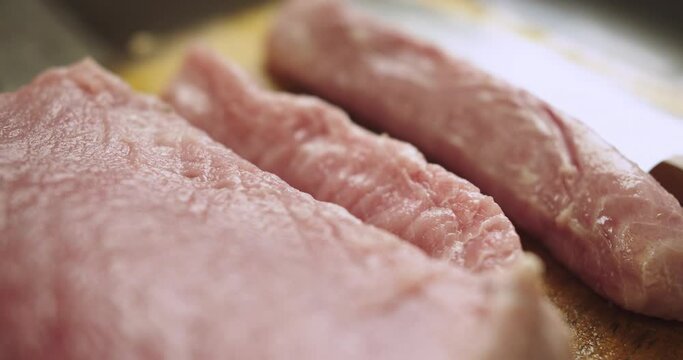 close-up of a tollo fish loin on a wooden board.