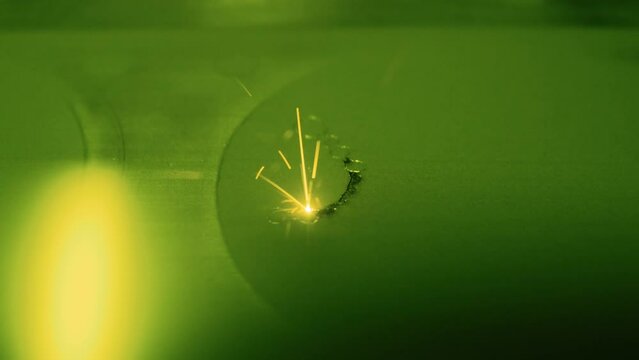 Selective laser melting, additive manufacturing metal 3D printer printing model - close up view, slow motion. Prototyping, metalworking, engraving, futuristic, production and technology concept.4K