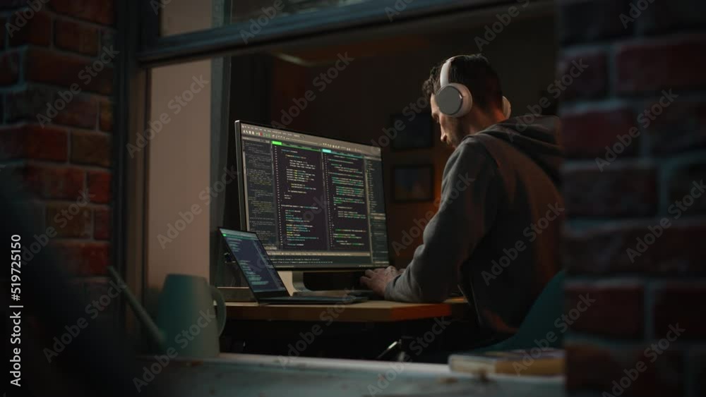 Fototapete Professional Software Developer Writing Mock-up Code with Basic Programming Language. Program Engineer. Information Technology Specialist. Remote Work Concept. View From Outdoors into Window.