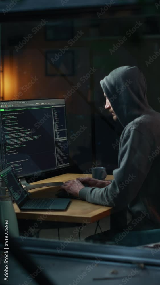 Poster vertical screen: night apartment: evil greedy hacker wearing hoodie breaks into data servers, does d