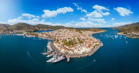 Panoramic aerial view of the town and harbour of Poros island, Saronic Gulf, Greece, during a sunny...