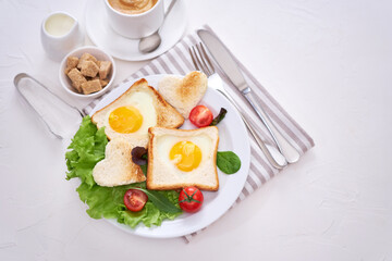 Fried Egg on Toast Bread and cup of fresh hot coffee on light grey background