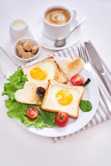 Fried Egg on Toast Bread and cup of fresh hot coffee on light grey background