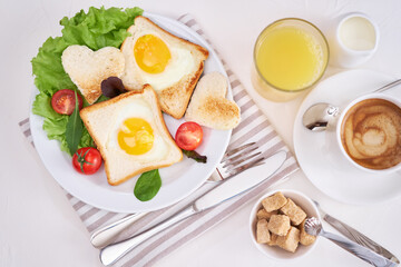Fried Egg on Toast Bread and cup of fresh hot coffee on light grey background