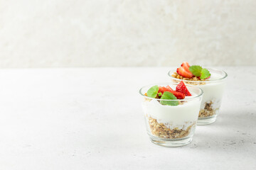 Healthy strawberry granola greek yogurt dessert. Top view, copy space,flat lay.