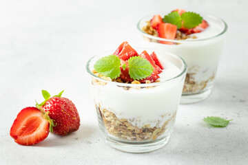 Healthy low calorie strawberry granola greek yogurt dessert. Top view, copy space,flat lay.