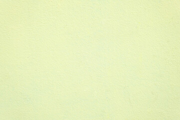 Horizontal shot of wall with texture in soft yellow colour