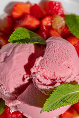 Strawberry ice cream with strawberries and fresh mint